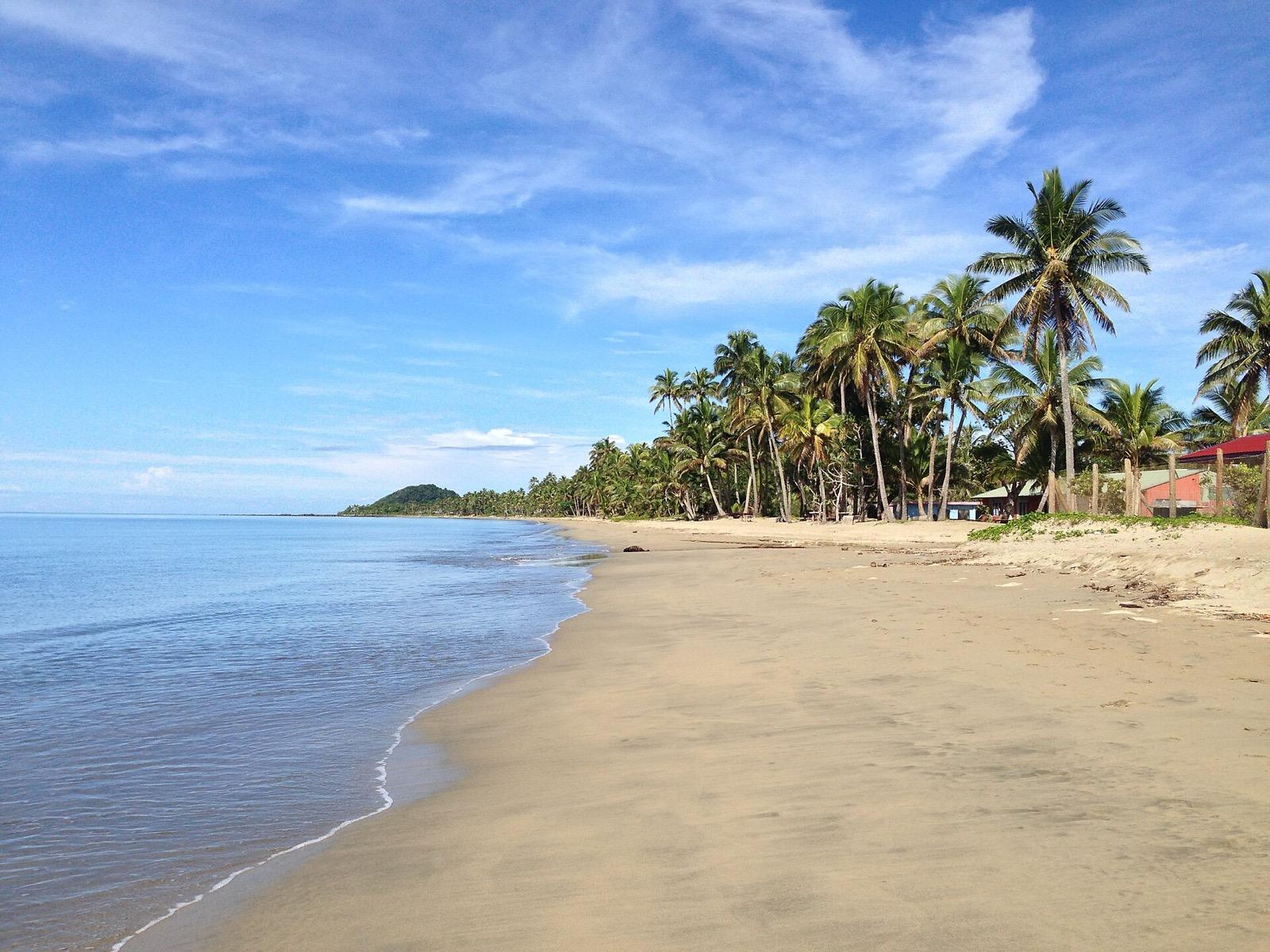 Palm-fringed island beach in Fiji