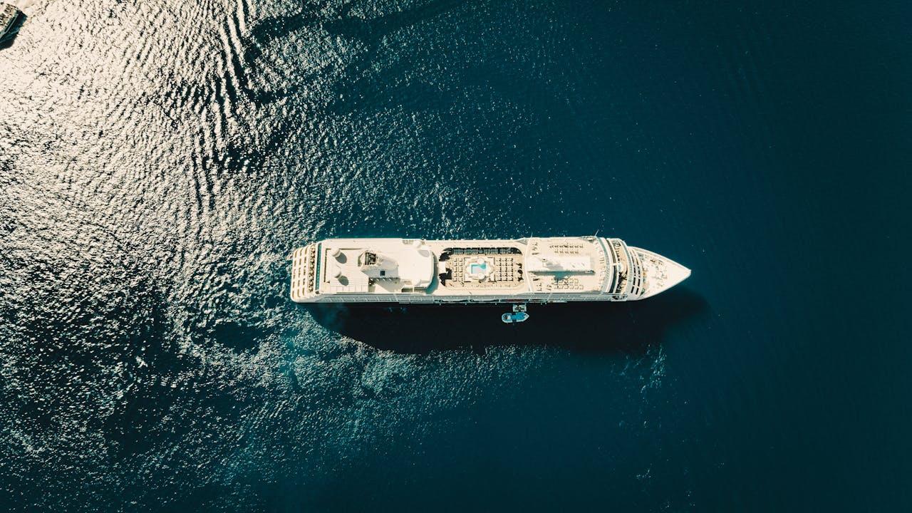 Cruise ship at a port of call with travellers preparing to go ashore
